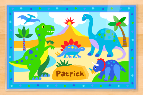 Cute dinosaurs in prehistoric scene with volcano on personalized placemat