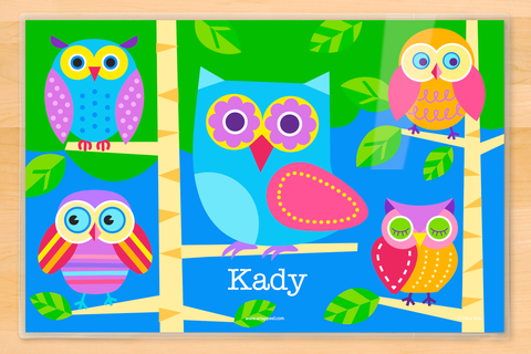 Five different colorful owls sitting on branches